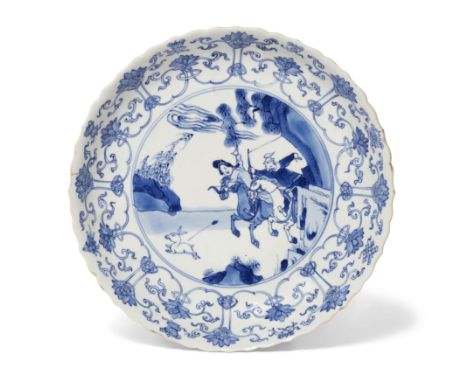A Chinese blue and white 'hunting' plateQing dynasty, Kangxi period, apocryphal Chenghua markFinely painted with a central sc