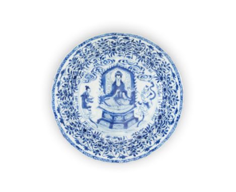 A rare Chinese blue and white 'Buddhist' dishQing dynasty, Kangxi periodPainted to the centre with Guanyin seated on a lotus 