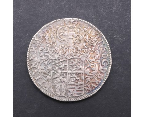 A Brunswick-Wolfenbuttel Thaler. Obverse shield of arms beneath three helmets and a leaping horse, Legend for Julius. Reverse