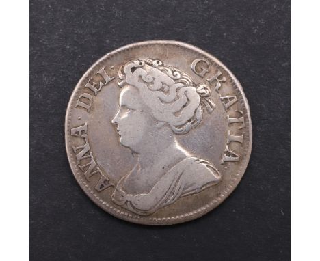 A Queen Anne shilling, fourth draped bust l. Reverse with crowned cruciform shields with vacant angles. Dated 1711. *CR A nic