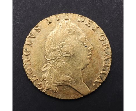 A George III Guinea, fifth laureate and draped bust r. Reverse with 'Spade' shaped shield and date 1793. *CR A superb example