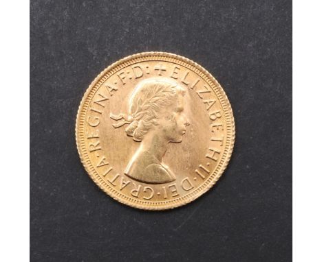 An Elizabeth II Sovereign, bare head bust r. reverse St. George and the Dragon, dated 1968. *CR Good condition, very light su