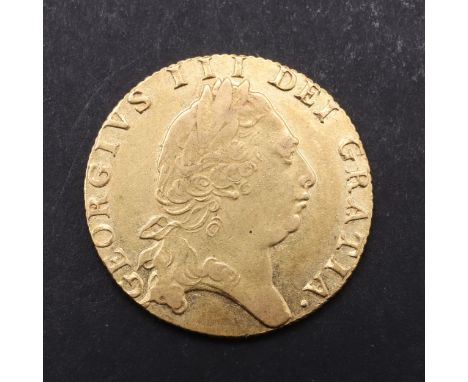 A George III Guinea, fifth laureate and draped bust r. Reverse with 'Spade' shaped shield and date 1794. *CR A superb example