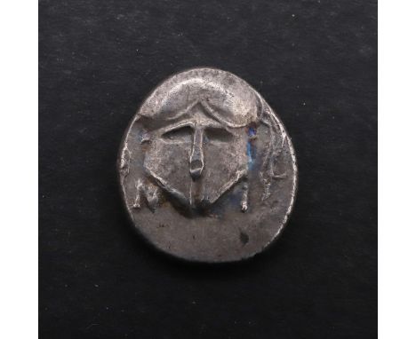 A silver diobol, crested helmet facing, Reverse Meta in the four quarters of a radiate wheel. 1.2 cm, c. 1.3g. *CR A nice cri