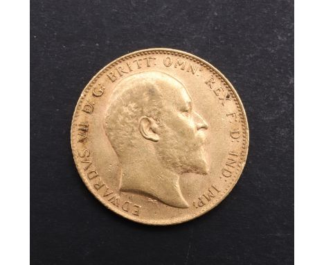 An Edward VII Sovereign, bare head bust r. St. George and Dragon reverse, dated 1910. *CR Marking and rubbing to both surface