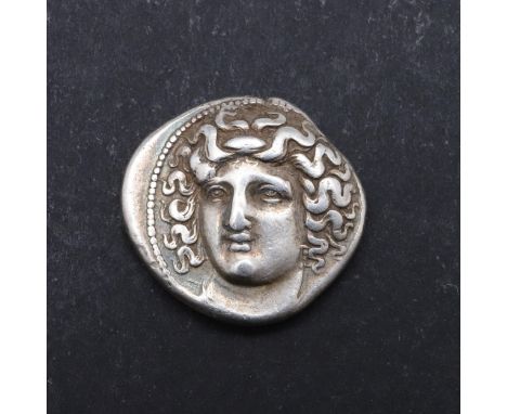 Silver Drachm, Thessaly, Larissa. Obverse Head of Nymph Larissa, three quarter facing to the left. Reverse a grazing horse r.