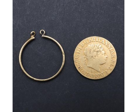 A George III Sovereign, laureate head r. legend with space between REX and F:D: (type B). Reverse with St George and the Drag