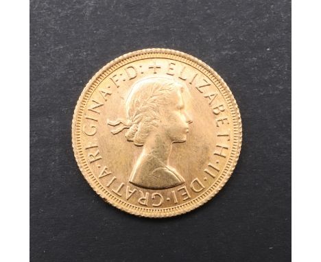 An Elizabeth II Sovereign, bare head bust r. reverse St. George and the Dragon, dated 1968. *CR Good condition, very light su