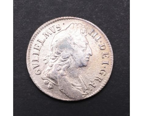 A William III Shilling, first laureate and draped bust r. Reverse with crowned cruciform shields and vacant angles. Dated 169