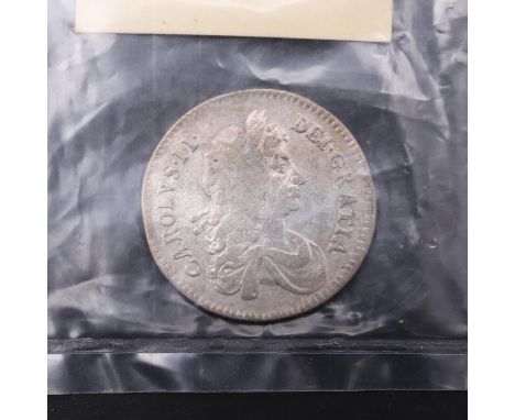 A Charles II Shilling, second draped bust r. Reverse with crowned cruciform shields and interlaced C's to the angles. Dated 1