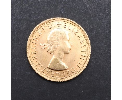 An Elizabeth II Sovereign, bare head bust r. reverse St. George and the Dragon, dated 1968. *CR Good condition, very light su