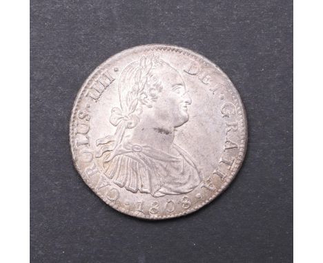 A Spanish Colonial 8 Reales coin, Charles IIII, laureate and draped bust r. reverse with twin pillars wither side of a crowne