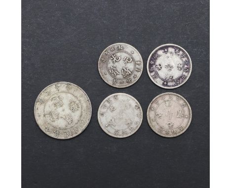 An interesting collection of five silver Chinese coins: Kwang-Tung Province 20 cents, Hu-Pen Province 7.2 Candareens and thre