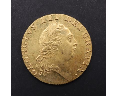 A George III Guinea, fifth laureate and draped bust r. Reverse with 'Spade' shaped shield and date 1787. *CR A superb example