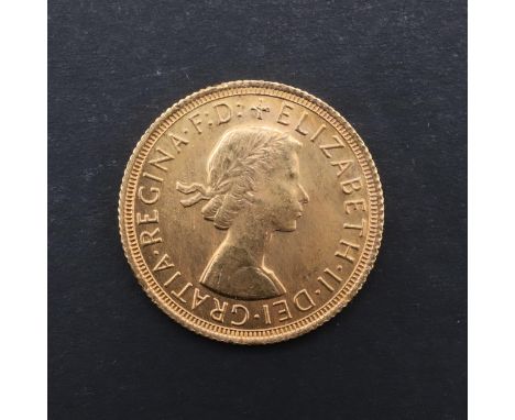 An Elizabeth II Sovereign, bare head bust r. reverse St. George and the Dragon, dated 1968. *CR Good condition, very light su