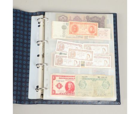 An interesting collection of World banknotes including notes from Hong Kong, Netherlands, Rwanda, Italy, Iraq, Indonesia, Cam