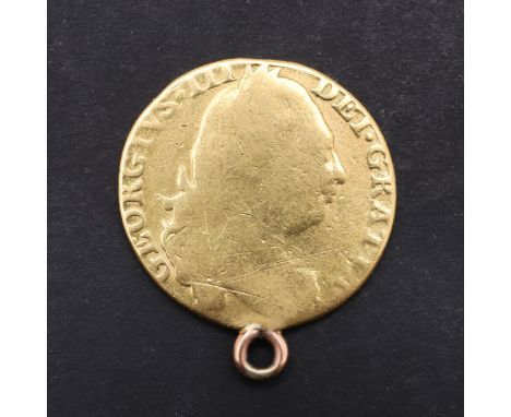 A George III Guinea, fourth laureate head r. Reverse crowned shield of arms, dated 1776. Attached loop for suspension. c.7.96