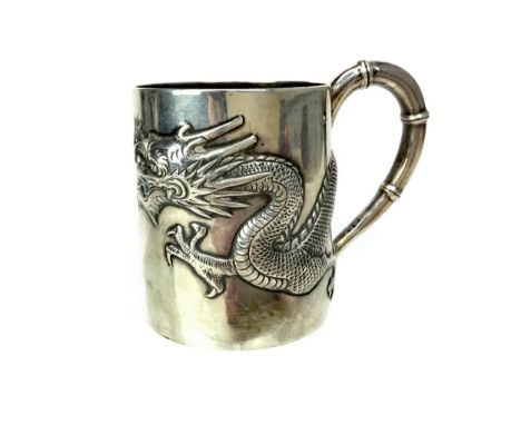 CHINESE SILVER MUG, of small proportions, with a dragon in relief to the body, the handle modelled as bamboo, Wang Hing, mark