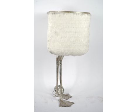 A contemporary whimsical table lamp, modelled as two duck feet with a scratched silver finish and goose feather shade.65cm ta