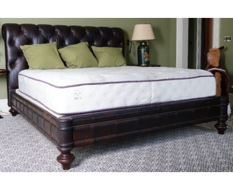 A King size Chesterfield bed, button-down upholstered in chocolate brown leather, 208cm wide x 144 high, with a Beautyrest ma