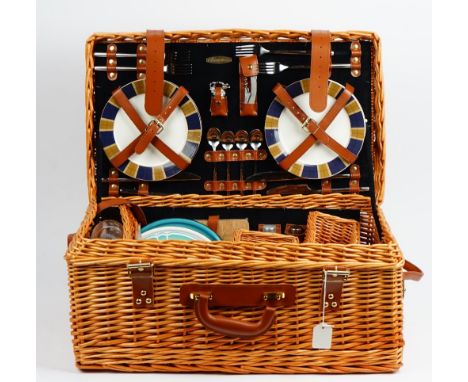 A 'Picnic Time' wicker picnic hamper, fitted for four persons, a small wicker hamper, wicker shopping basket and two trays (5
