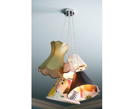 A pendant light fitting composed of five varying lamp shades.