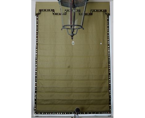 A Roman blind, in green linen with button border.135cm wide x 210cm long