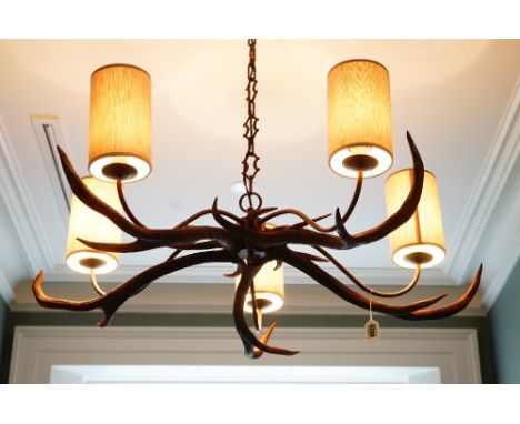 A five light chandelier composed of antlers, approximately 105cm diameter.