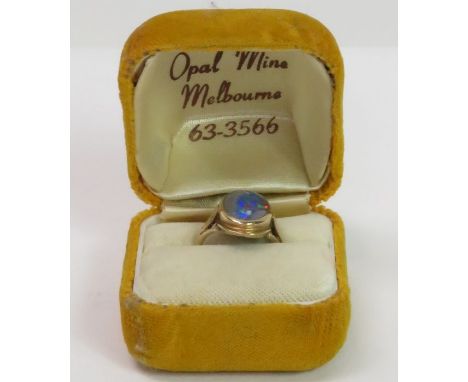 An opal triplet set ring, stamped ‘9ct’, finger size K1/2, 4 grams gross 