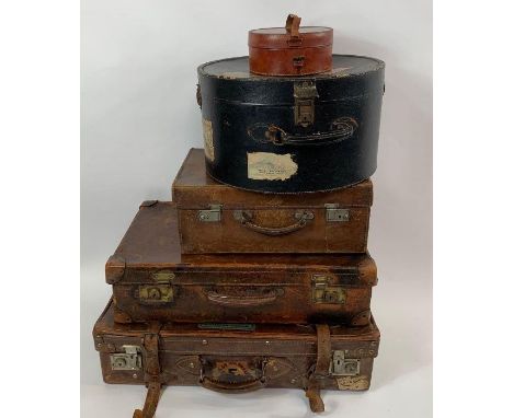 Three brown leather vintage suitcases, various sizes; a black hat box and a leather collar box