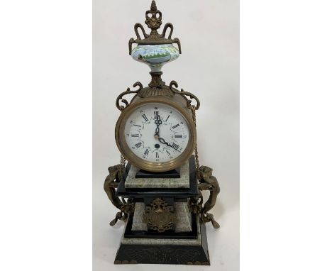 A 20th century ornate French style black slate/marble mantle clock decorated with brass mermaid figures on either side of the