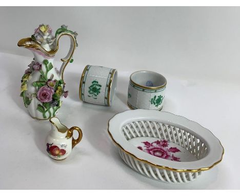 A small Herend, Hungary porcelain basket, the centre decorated with deep pink flowers and leaves, picked out in gilt, blue ma
