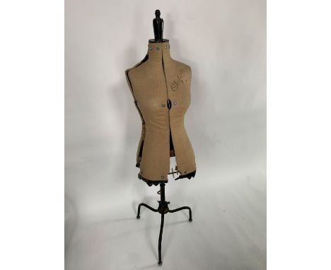 A 20th century Chil Daw adjustable dress makers mannequin, black painted metal three leg base with height adjustment, linen c