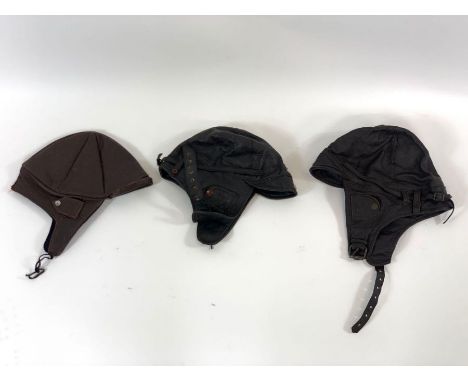Three vintage leather car/flying helmets 