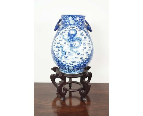 CHINESE STYLE VASE, blue and white ceramic on wooden stand, 72cm H x 40cm. 