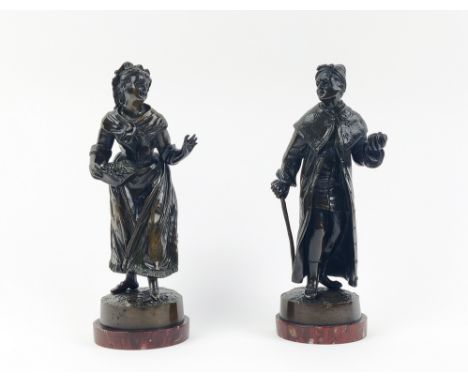 BRONZE FIGURES, two, 19th century continental, one of a caped gentleman and a lady with a basket of fruit, 25cm H. (2) 