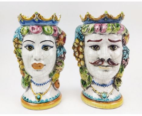 SICILIAN CERAMIC HEAD VASES, a pair, a lady and a gentleman, with hanging fruit embellishments, 26cm H. (2) 