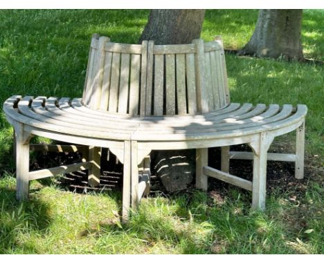 GARDEN TREE BENCH, nicely weathered teak forming half round (two quadrants) of slatted form with uprights, 177cm W approx. 