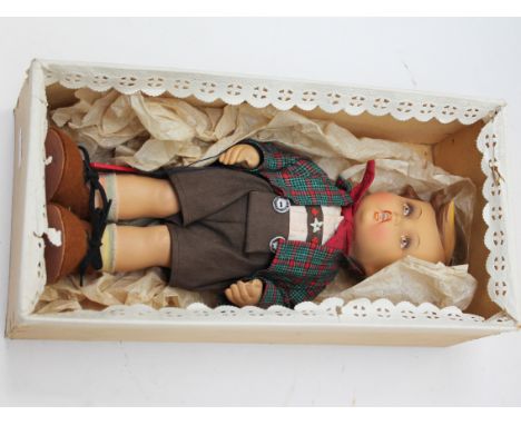 A Goebel boy doll. L27cm. Condition - doesn't appear to have ever been out of the box.