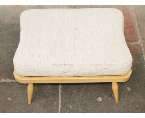 An Ercol light beech ottoman. L69cm