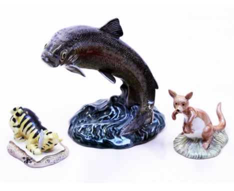 A group of three ornaments comprising a Beswick Trout no 1032 and two Royal Doulton Winnie The Pooh figures "Tigger Signs the