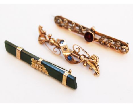 A group of three 9ct gold brooches comprising one jade, one set with seed pearls and another set with blue stones. Gross wt. 