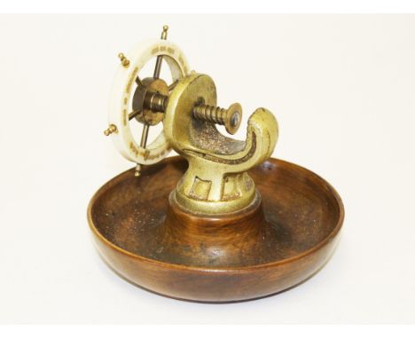 A nut cracker in the form of a ships wheel. Diam.14cm. Condition - no damage, general wear only to include minor marks and sc