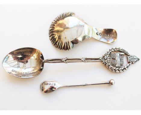 A group of three hallmarked silver spoons comprising a Georgian caddy spoon, a motor club spoon and a mustard spoon