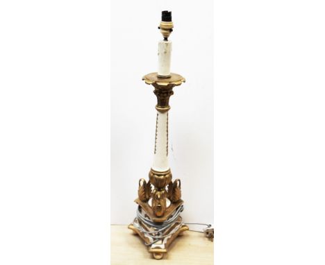 An early 20th Century lamp with ivory feet. H76cm. Condtion - good, general wear to include minor chips, marks etc.