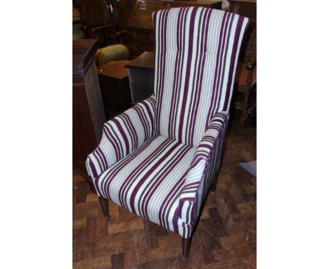 19th century fire side chair on tapered mahogany legs with brass castors and brown ceramic wheels We do not supply condition 