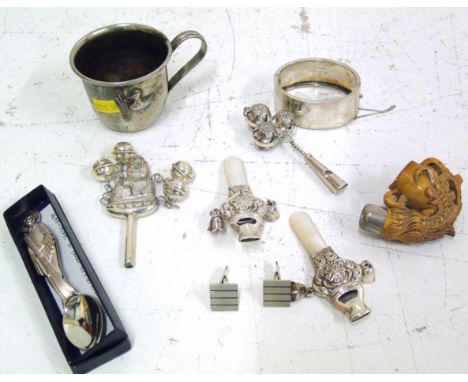 A selection of silver and white metal items, to include four silver rattles, a white metal christening cup, a pair of silver 