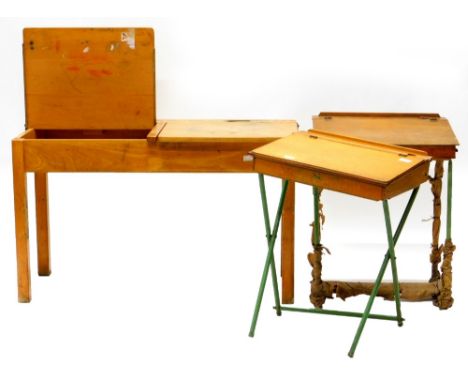 A Tri-ang child's vintage desk, with hinged top and metal legs, another similar desk and a double child's desk.  (3)