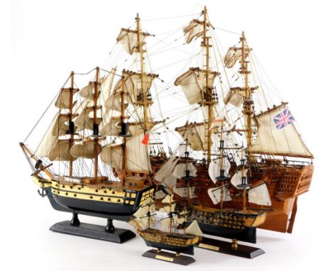 A scale model of a three masted ship, another smaller ship, and two models of HMS Victory. (4)