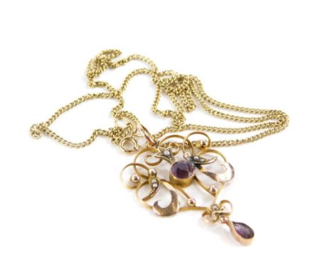An Art Nouveau pendant and chain, the Art Nouveau pendant set with central amethyst and seed pearls, yellow metal stamped 9ct
